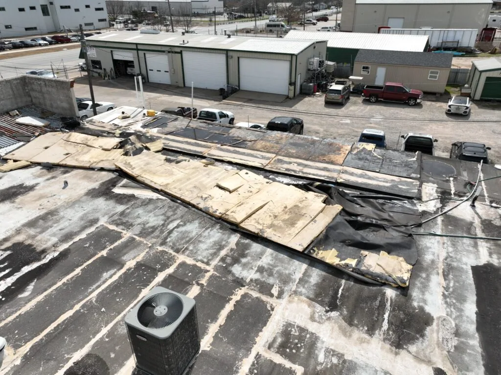 Hail and wind damaged commercial roof